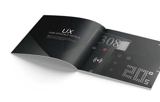 Photo d'une brochure ouverte mettant en valeur les produits UX for upscale hotels de la marque Legrand.
